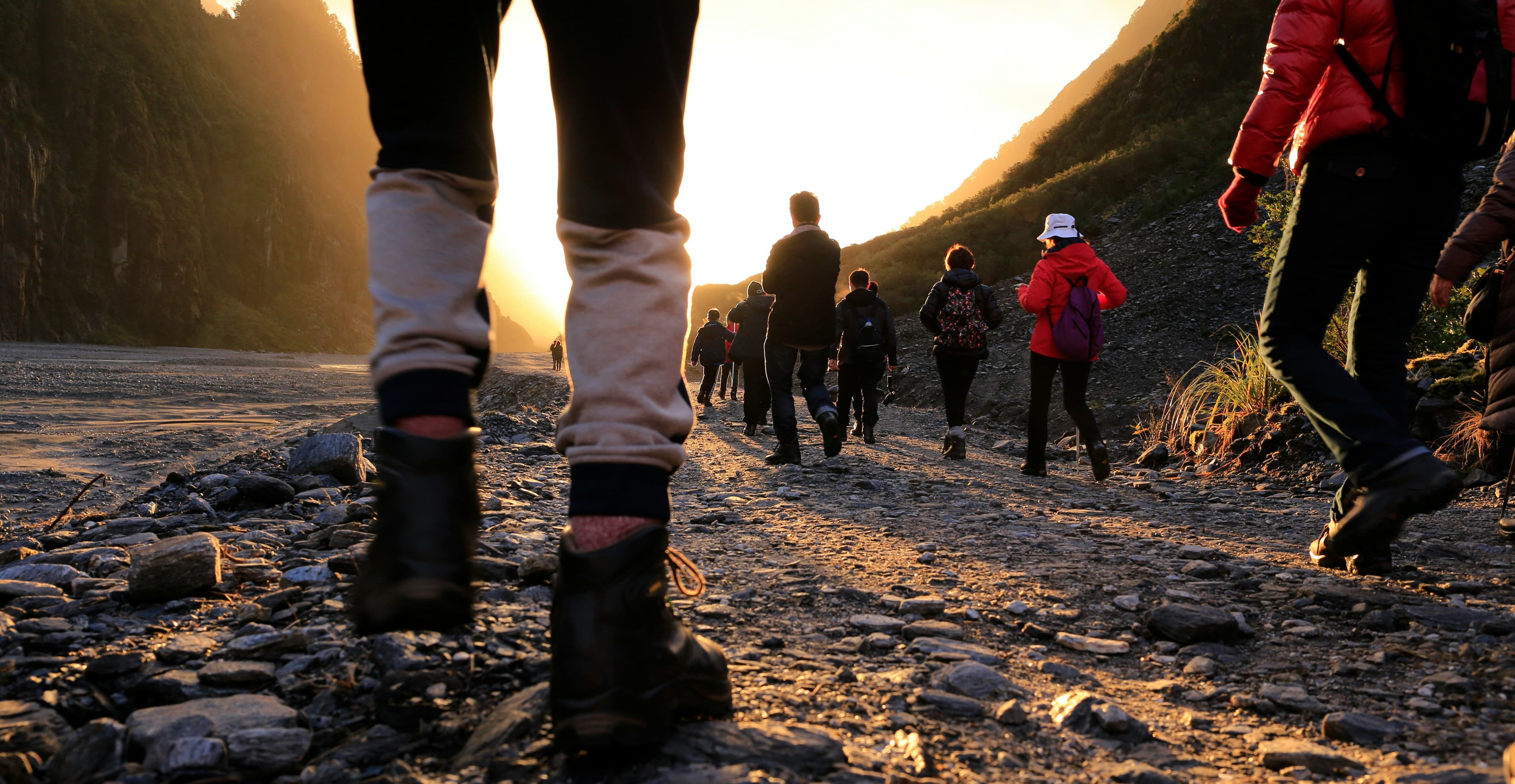 A group hiking together at sunrise